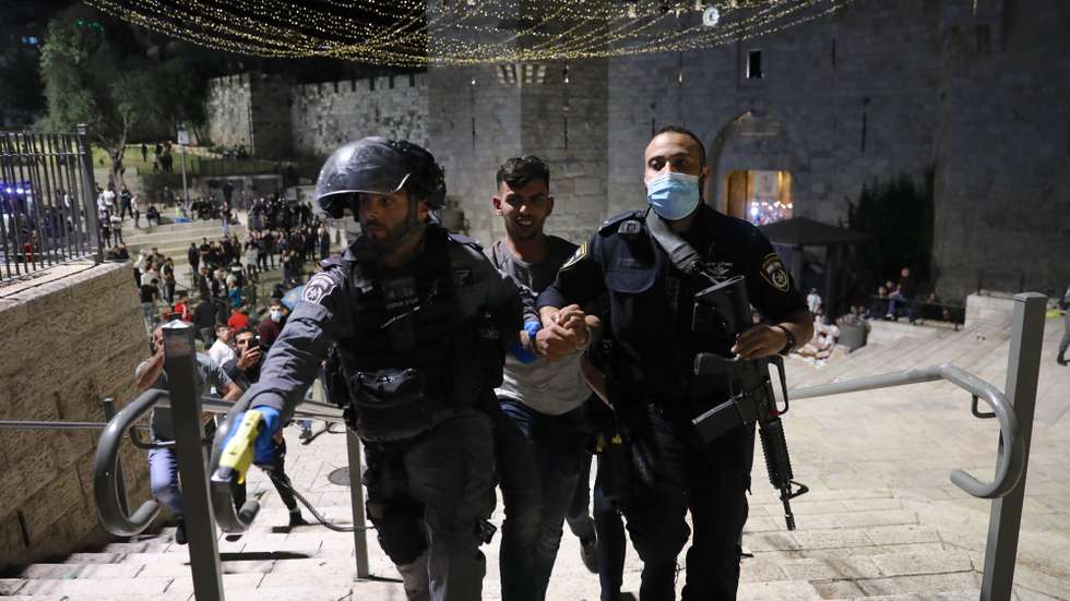 epa09183969 Israeli border police arrest a Palestinian protester during a protest supporting Palestinians families that face eviction from their homes at Sheikh Jarrah neighborhood in East Jerusalem, 07 May 2021. An Israeli court in East Jerusalem ordered the eviction of six Palestinian families from their homes in favor of Jewish families who claimed they used to live in the houses before fleeing in Israel's 1948 war for independence. The Palestinian residents filed an appeal and a final verdict is expected on 10 May.  EPA/ABIR SULTAN