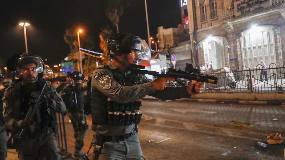 epa09186629 Israeli border police during a protest in support of Palestinian families that face eviction from their homes at Sheikh Jarrah neighborhood, near Damascus gate in the old city of Jerusalem, 08 May 2021. An Israeli court in East Jerusalem ordered the eviction of six Palestinian families from their homes in favor of Jewish families who claimed they used to live in the houses before fleeing in the 1948 war that led to the creation of Israel. The Palestinian residents filed an appeal and a final verdict is expected on 10 May.  EPA/ATEF SAFADI