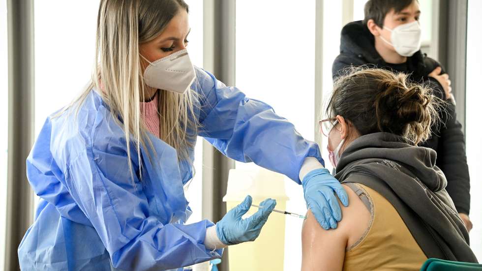 epa09184813 A woman receives a shot of COVID-19 vaccine at the Cologne Central Mosque in Cologne, Germany, 08 May 2021. Citizens of Cologne can receive a shot of AstraZeneca vaccine within the mosque premises without previous registration.  EPA/SASCHA STEINBACH