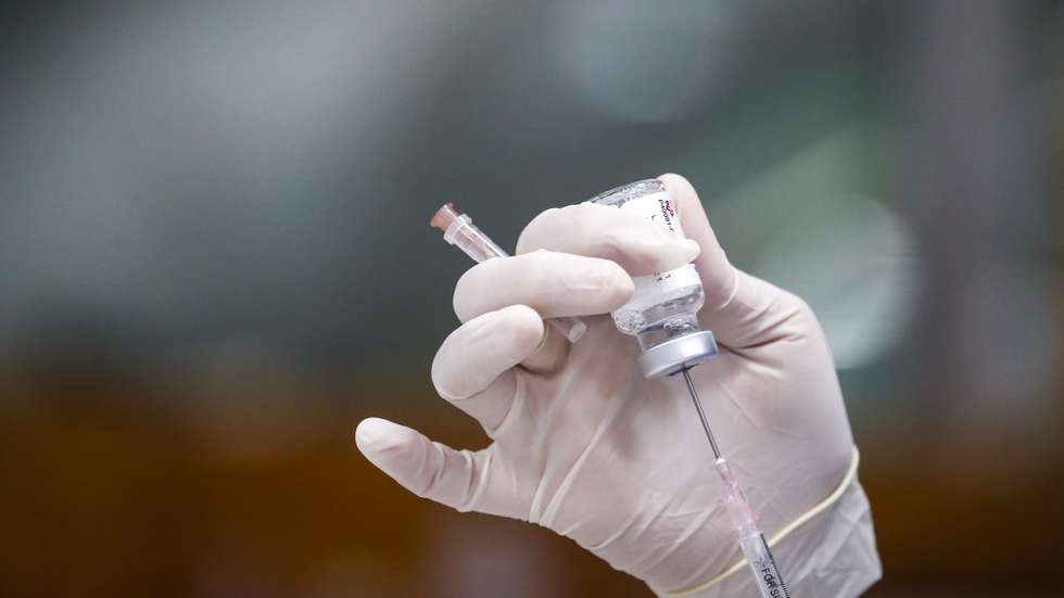 epa09330892 A Thai health official prepares a syringe with AstraZenca COVID-19 vaccine at a vaccination center set up inside the Bang Sue Grand Station in Bangkok, Thailand, 08 July 2021. Bangkok is considering to impose a new lockdown after recording 75 deaths and over 7,000 new COVID-19 infections according to the Centre for Covid-19 Situation Administration.  EPA/DIEGO AZUBEL