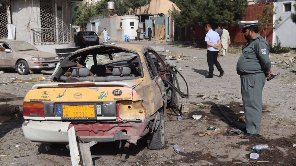 epa09393239 Afghan security officials stand guard outside the house of acting Defense minister Gen. Bismillah Mohammadi, after an overnight explosion and attack, in Kabul, Afghanistan, 04 August 2021. At least eight people were killed including the four assailants - and 11 wounded while Mohammadi was not at home at the time and was unharmed. The attack comes at a time of marked instability in Afghanistan, where the May 1 start of the definitive withdrawal of United States-led foreign forces from the country has triggered an unprecedented Taliban offensive.  EPA/JAWED KARGAR