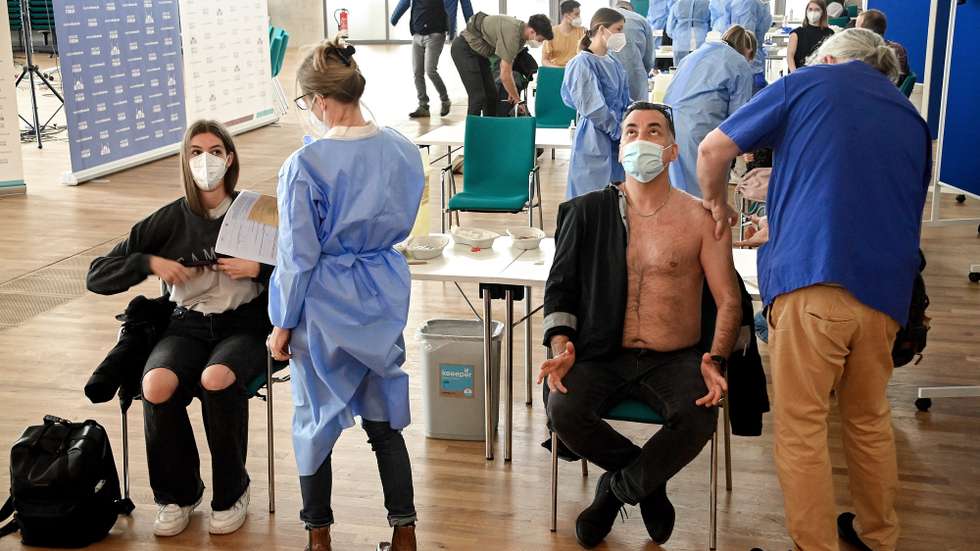 epa09184812 People receive a shot of COVID-19 vaccine at the Cologne Central Mosque in Cologne, Germany, 08 May 2021. Citizens of Cologne can receive a shot of AstraZeneca vaccine within the mosque premises without previous registration.  EPA/SASCHA STEINBACH