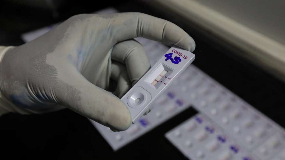 epa09310306 A Sri Lankan health officer performs COVID-19 Rapid Antigen Tests at a mobile laboratory just after collecting swabs from the community amid the coronavirus pandemic in Colombo, Sri Lanka, 29 June 2021. According to Health authorities, three new COVID-19 patients infected with highly transmissible Delta variant of COVID-19 were detected on June 28 at a construction site in Colombo. Earlier, authorities detected five patients contracted with Delta variant of SARS-Cov-2  in the Colombo city area. Sri Lanka is currently in the midst of the third wave of the COVID-19 virus pandemic and the number of cases is increasing day by day.  EPA/CHAMILA KARUNARATHNE