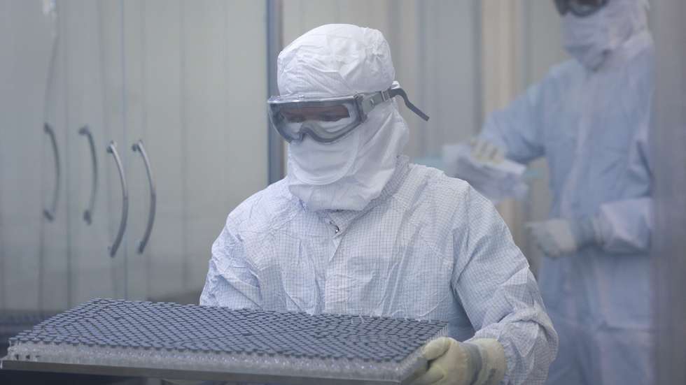 epa09231596 Fiocruz employees work on the production of the active pharmaceutical (IFA) that will allow the production of vaccines against COVID-19, in Rio de Janeiro, Brazil, 27 May 2021. The Oswaldo Cruz Foundation (Fiocruz) restarted the manufacture of the immunizer developed by the AstraZeneca laboratory and the University of Oxford after the arrival on 22 May of a shipment of IFA, the main pharmacological component of the vaccine, enough for the development of another 12 million dose.  EPA/Andre Coelho