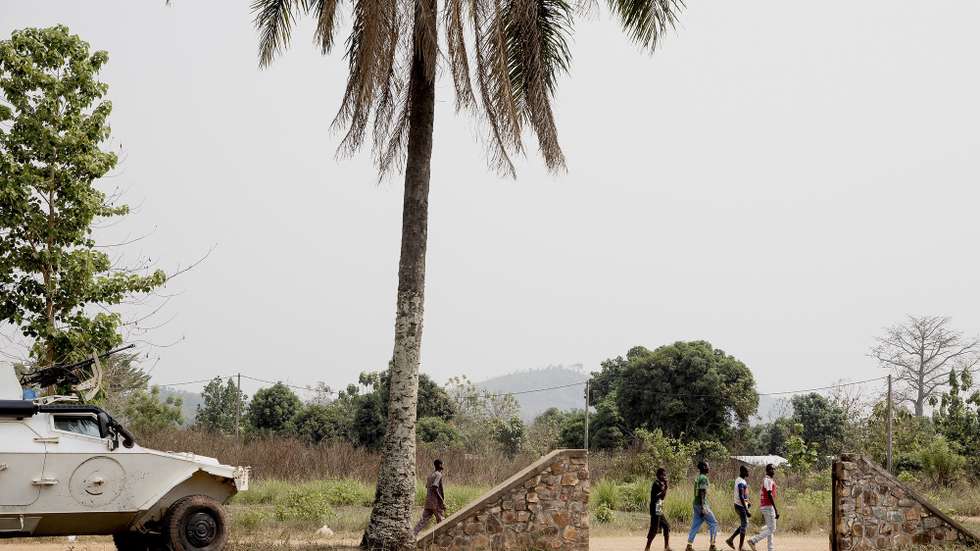 epa09002035 People walk past a United Nations armored vehicle by the new Internally displaced people's (IDP) site in Liton, Central African Republic, 10 February 2021. The Central African Republic has extended the current state of emergency for six months as the fight against a coalition of rebel groups not part of this peace agreement continues. The IDPs have been given food aid by the organisation PAM once, and non-food items by Action Contre la Faim. More international organisations are waiting for possibilities of actions but even though Liton is only 22 kilometers away from Bangui they haven't been able to reach due to security concerns. 2559 people have been displaced in the village of Liton, in the Central African Republic mid-January. They fled when alert was given that more than a hundred armed men from the Coalition of Patriots for Change (CPC) a coalition of armed groups formed on 19 December 2020 prior to the elections. More than 240,000 people have left their homes, to take refuge in neighbouring countries, or inside the Central African Republic since 15 December 2020 according to the United Nations Office for the Coordination of Humanitarian Affairs (OCHA).  EPA/ADRIENNE SURPRENANT