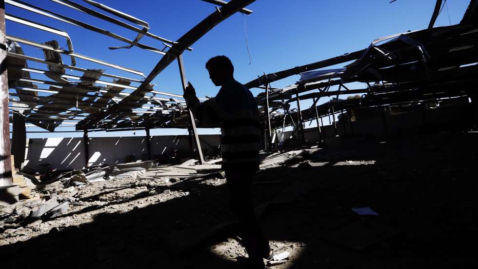 epa09631113 A Yemeni inspects the wreckage of a warehouse of the local water service after it was hit by Saudi-led airstrikes in Sanaâ€™a, Yemen, 09 December 2021. The Saudi-led coalition intensifies airstrikes on the Houthis-held provinces of Yemen, including the capital Sanaâ€™a, as the Houthis continue to escalate their explosives-laden drone and missile attacks against Saudi Arabia.  EPA/YAHYA ARHAB
