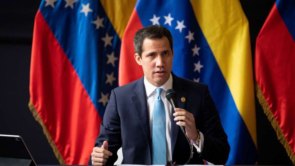 epa09668557 Opposition member Juan Guaido speaks during a ceremony, in Caracas, Venezuela, 05 January 2022. The opposition Juan Guaido ratified this 05 January the willingness of the group that he leads to resume the dialogue with the Government of Venezuela, interrupted on October 16 by decision of the ruling party, in protest at the extradition of businessman Alex Saab - alleged front man of the president Nicolas Maduro- from Cape Verde to the United States, where he faces a legal process for money laundering.  EPA/Rayner Pena R.