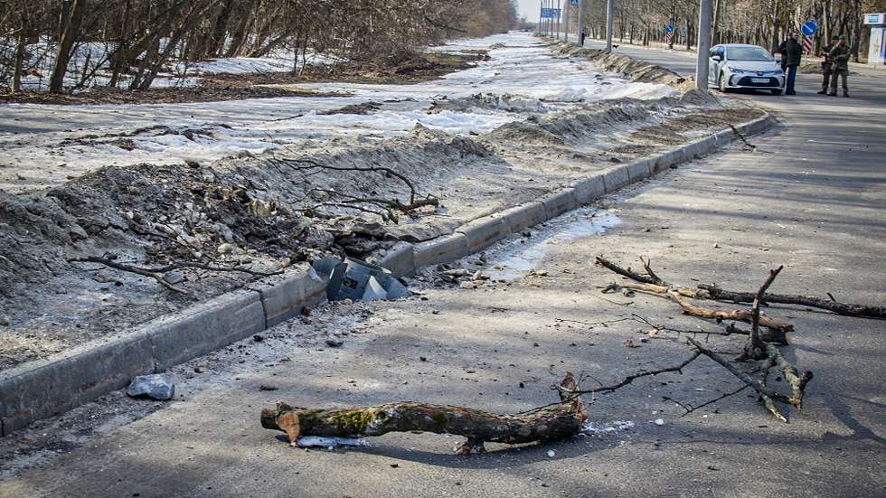 epa09780970 A jet missile wedged into a damaged roadside in the aftermath of Russian military operation in Kharkiv, Ukraine, 24 February 2022. Russian President Vladimir Putin announced a 'special military operation' in the Donbass with the aim, as he put it, of demilitarizing and denazifying Ukraine, as well as bringing to justice those who committed numerous bloody crimes against civilians. Martial law has been introduced in Ukraine, explosions are heard in many cities, including Kiev after Russian troops launched a major military operation on Ukraine on 24 February.  EPA/SERGEY KOZLOV