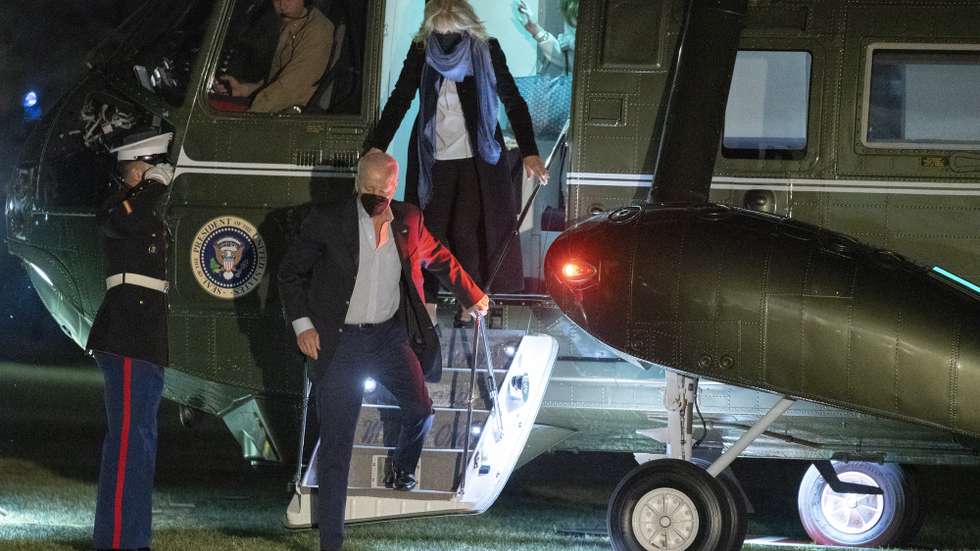 epa09806700 US President Joe Biden (C) and first lady Dr. Jill Biden (R) return to the White House in Washington, DC, USA, 06 March 2022, after spending the weekend in Wilmington, DE.  EPA/Chris Kleponis / POOL