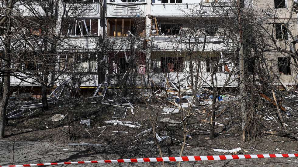 epa09826876 People clean the debris of a building damaged by shelling in Kyiv, Ukraine, 15 March 2022. On 24 February Russian troops had entered Ukrainian territory in what the Russian president declared a 'special military operation', resulting in fighting and destruction in the country, a huge flow of refugees, and multiple sanctions against Russia.  EPA/MIGUEL A. LOPES