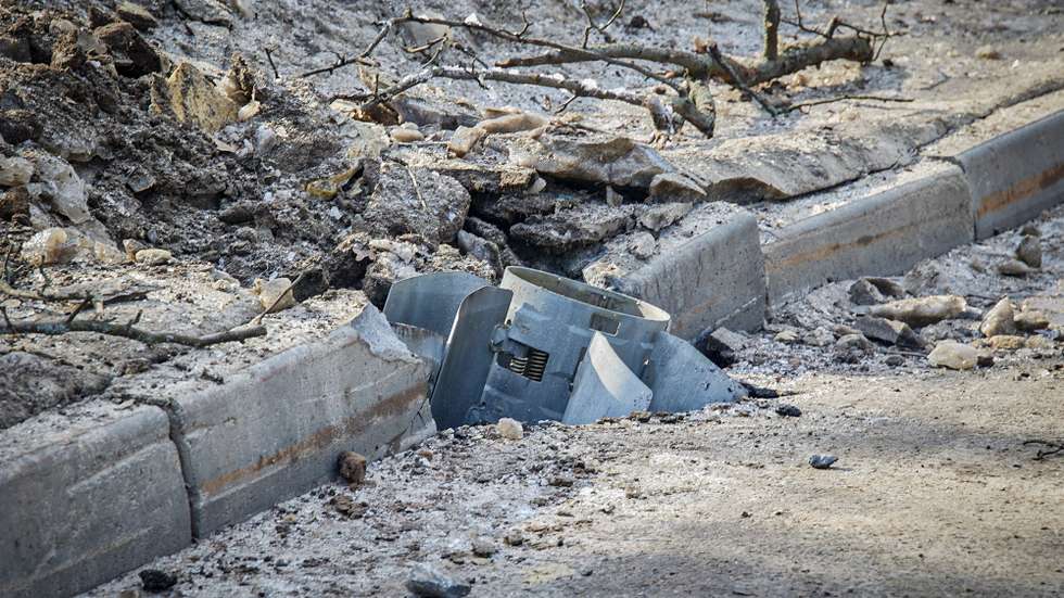 epa09780968 A jet missile wedged into a damaged roadside in the aftermath of Russian military operation in Kharkiv, Ukraine, 24 February 2022. Russian President Vladimir Putin announced a 'special military operation' in the Donbass with the aim, as he put it, of demilitarizing and denazifying Ukraine, as well as bringing to justice those who committed numerous bloody crimes against civilians. Martial law has been introduced in Ukraine, explosions are heard in many cities, including Kiev after Russian troops launched a major military operation on Ukraine on 24 February.  EPA/SERGEY KOZLOV