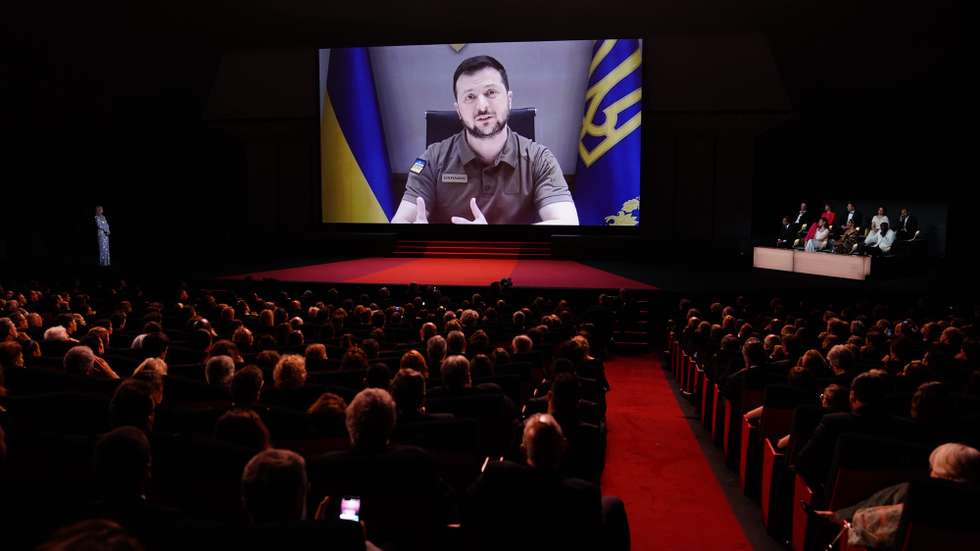 epaselect epa09953398 Ukraine's President Volodymyr Zelensky appears on a screen during the Opening Ceremony of the 75th annual Cannes Film Festival, in Cannes, France, 17 May 2022. The festival runs from 17 to 28 May.  EPA/CLEMENS BILAN