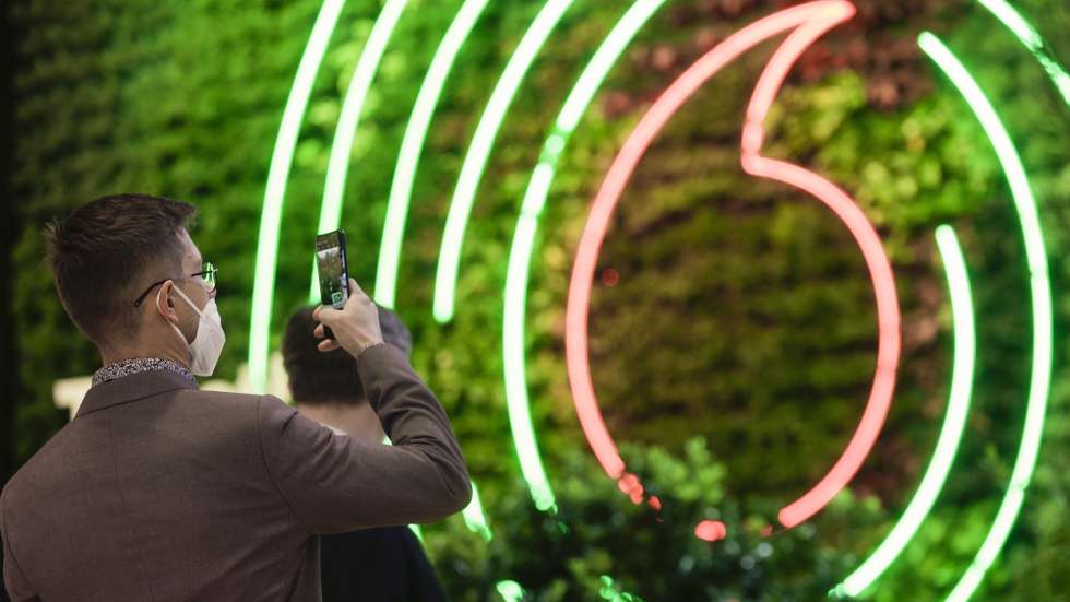 epa09798772 A visitor takes a photo of a vertical garden at Vodafone exhibitior at Mobile World Congress (MWC), in Barcelona, northeastern Spain, 03 March 2022. Vodafone launched ten exhibitions of key network technologies for green transition under the motto 'Digital for Green'. The Mobile World Congress, running from 28 February to 03 March 2022, is the largest technology fair in the world.  EPA/QUIQUE GARCIA