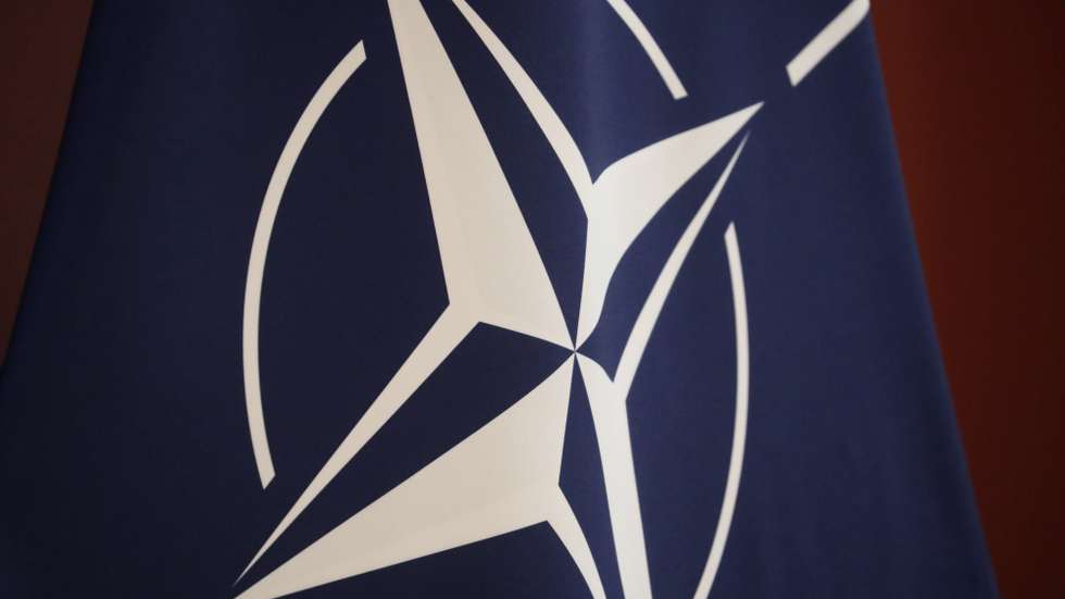 epa09861591 The NATO flag is seen during a meeting of the Danish Prime Minister and the Latvian Prime Minister (both not pictured) in Riga, Latvia, 31 March 2022. The Latvian Prime Minister and Danish Prime Minister discussed, during the meeting, the security situation in Europe, support for Ukraine and further steps towards the international isolation of the Putin regime following Russia's agression against Ukraine. They also discussed energy security and investment in renewable energy, as well as how EU countries will rapidly reduce dependence on Russian energy.  EPA/TOMS KALNINS