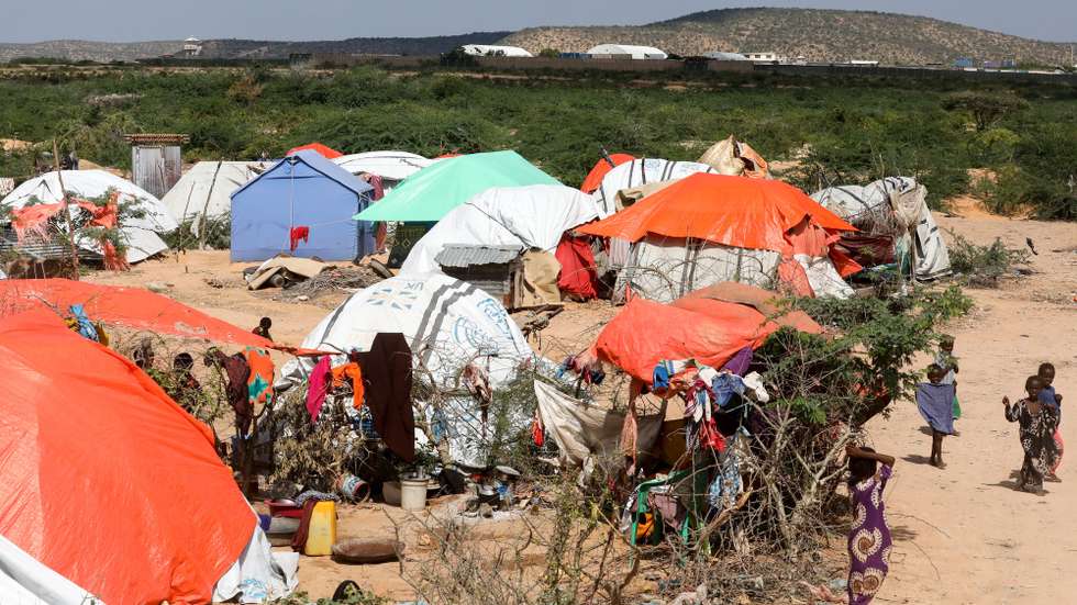 epa08078809 Children (R) play outside their makeshift tents at an Internally Displaced Persons (IDP) camp in Belet Weyne, Hirshabelle state, some 350 kilometres north of the capital Mogadishu, Somalia, 14 December 2019 (issued 18 December 2019). At least 110,000 people have been displaced after Shabelle river burst its banks in late October 2019 following heavy rains in the region. According to the United Nations Office for the Coordination of Humanitarian Affairs (UN OCHA) in Somalia, the rains have inundated 207,000 hectares of land along Shabelle and Juba rivers, raising concerns about food security.  EPA/Daniel Irungu