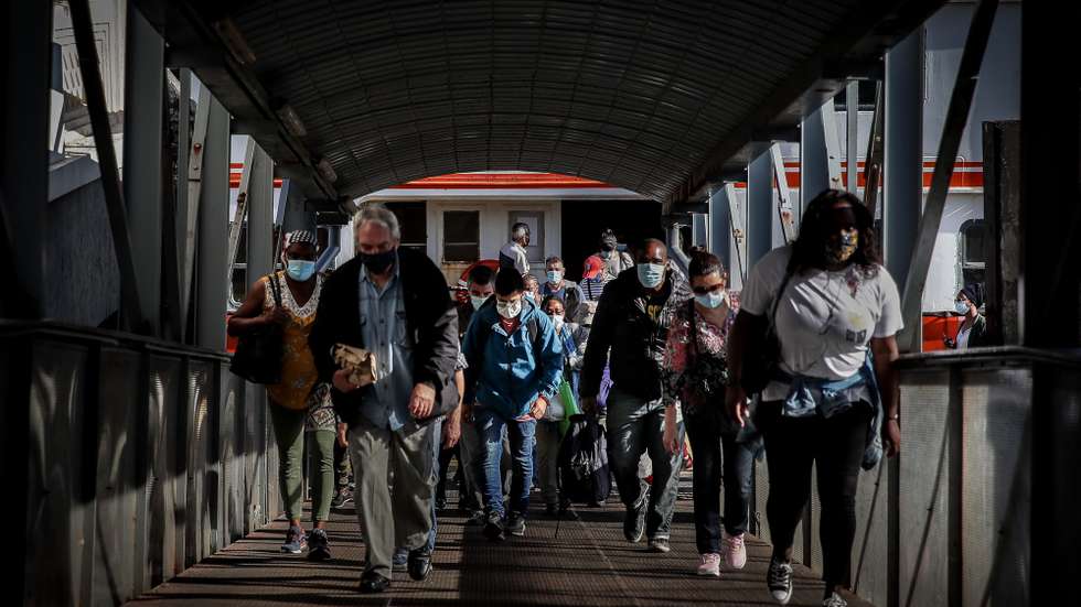 People coming from Lisbon arrive at Cacilhas station, Almada, Portugal, 20 May 2020. Public transportation has been strengthened with the entry of the second phase of deconfinement due to the covid-19 pandemic, despite this, careers are still short, which contrasts with the large use of river transport by Transtejo/Soflusa. MARIO CRUZ/LUSA