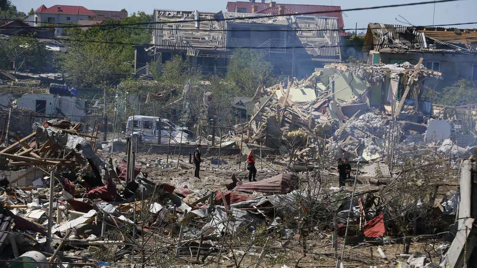 epa10092249 Rescuers and policemen inspect a site of a missile strike in Odesa area, Ukraine, 26 July 2022. A massive missile strike was inflicted on the south of Ukraine in the wee hours of 26 July by Russian forces from the waters of the Black Sea, the spokesperson of the Command of the Air Force of the Armed Forces of Ukraine said. Several private buildings and infrastructure objects were destroyed, no fatalities in that attack were reported. Russian troops on 24 February entered Ukrainian territory, starting a conflict that has provoked destruction and a humanitarian crisis.  EPA/STRINGER
