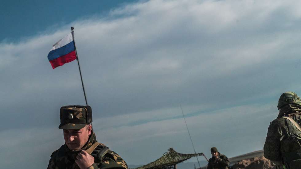 epa09033346 (16/27) Russian Border Police soldiers guard a checkpoint in Lachin Corridor Crossing, Azerbaijan, 14 January 2021. After a ceasefire agreement on 10 November 2020, Russian authorities deployed a peacekeeping force of 2,000 soldiers.  EPA/CHRISTOPHE PETIT TESSON  ATTENTION: For the full PHOTO ESSAY text please see Advisory Notice epa09033329 and epa09033330