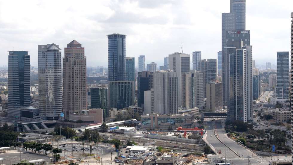 epa08390632 An general view of empty roads with Tel Aviv skyline during Israel's Independence Day (Yom Ha'atzmaut) festivities in Tel Aviv, Israel, 29 April 2020. Israel marks its 72nd anniversary of the Declaration of Independence in 1948. The annual airshow performance over Israeli beaches has been canceled and changed to a solidarity flight over Israeli hospitals during a nationwide lockdown due to the coronavirus disease (COVID-19) pandemic.  EPA/ABIR SULTAN