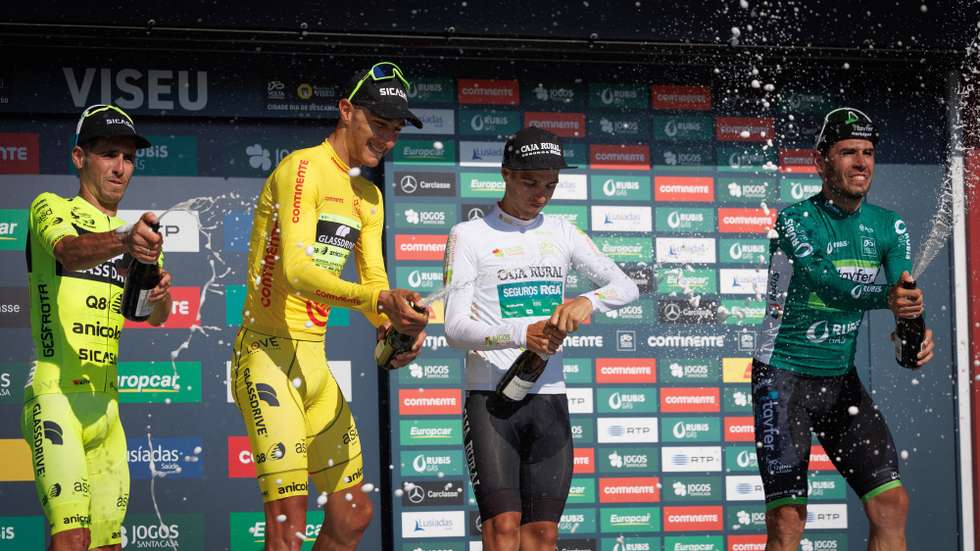 epa10111738 Portuguese rider, Frederico Figueiredo, from team Glassdrive/Q8/Anicolor, Uruguayan rider, Mauricio Moreira, from team Glassdrive/Q8/Anicolor (yellow jersey), Colombian rider, Jhojan Garcia, from team (CJR) Caja Rural (youth jersey) and Portuguese rider Joao Matias, with the dorsal number 92, from the Tavfer-Mortagua-Ovos Matinados team, celebrate on the podium after the fourth stage of the Portugal Cycling Tour, over 169,1 km between Guarda and Viseu, Portugal, 8th August 2022.  EPA/PEDRO SARMENTO COSTA