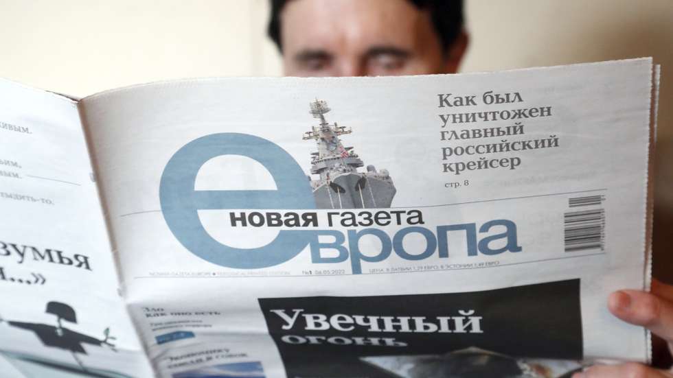 epaselect epa09930420 A woman reads a copy of Novaya Gazeta's European version newspaper, at a flat in Riga, Latvia, 06 May 2022. Anti-Kremlin newspaper Novaya Gazeta had suspended publication in Russia under pressure from the authorities. On 06 May, the first print edition of Novaya Gazeta Europa appeared in Latvia.  EPA/TOMS KALNINS  EPA-EFE/TOMS KALNINS