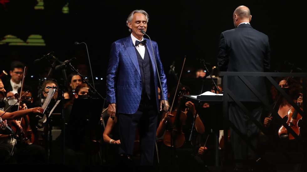 epa09301946 Italian tenor Andrea Bocelli performs during a concert at the Cidade de Coimbra stadium in Coimbra, Centre of Portugal, 25 June 2021.  EPA/PAULO NOVAIS