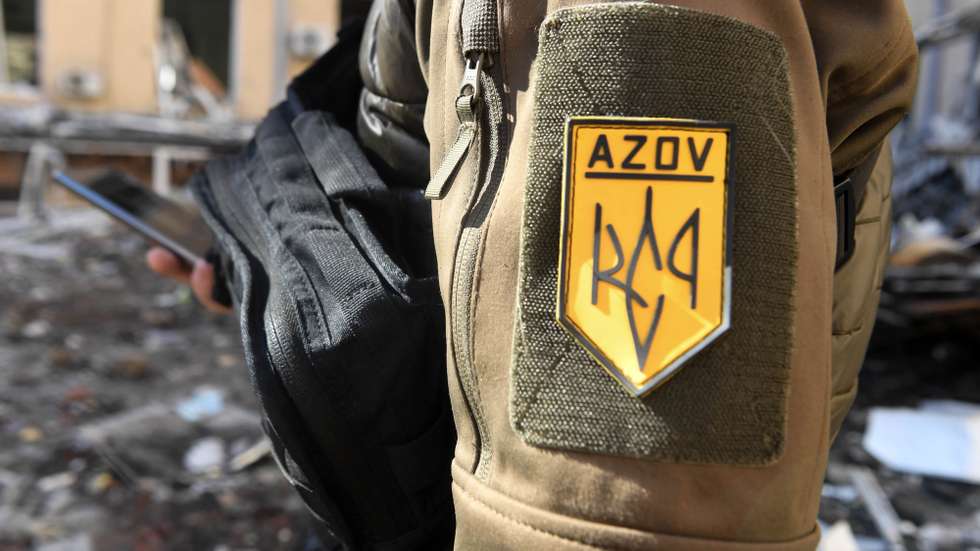 epa09842897 A Ukrainian soldier of Azov Battalion in Kharkiv, Ukraine, 22 March 2022. Russian troops entered Ukraine on 24 February resulting in fighting and destruction in the country, and triggering a series of severe economic sanctions on Russia by Western countries.  EPA/ANDRZEJ LANGE POLAND OUT