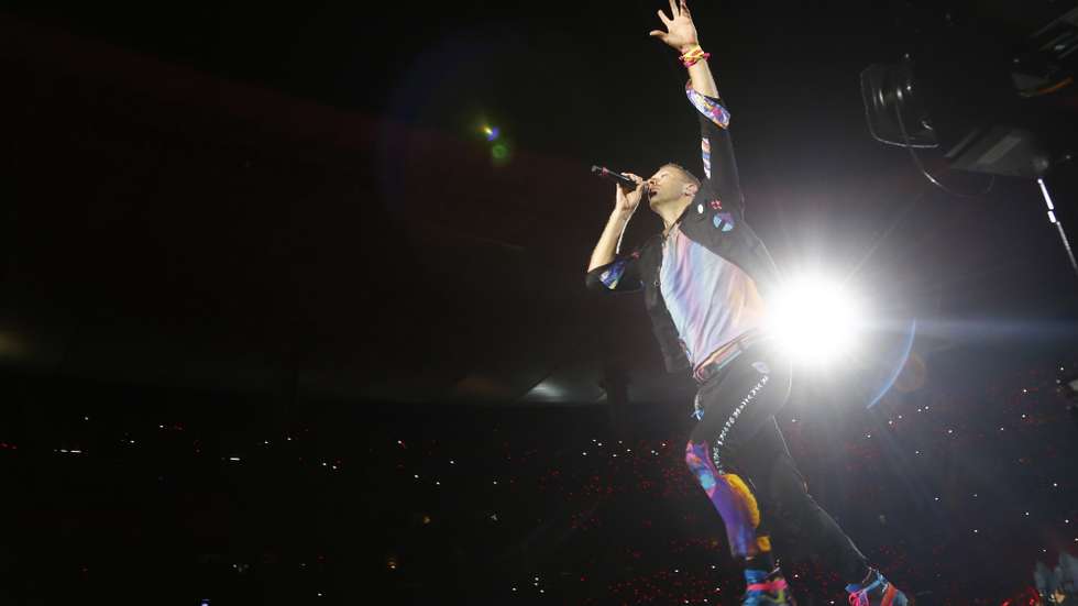 epa09859915 The vocalist of the British rock-pop band Coldplay Chris Martin performs, as part of his 'Music of the Spheres' world tour, at the Akron Stadium in Zapopan, Jalisco state, Mexico, 29 March 2022.  EPA/Francisco Guasco