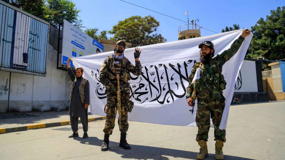 epa10149547 The Taliban celebrate the first anniversary of the US withdrawal outside the building of the former US embassy in Kabul, Afghanistan, 31 August 2022. The Taliban government on 30 August, declared 31 August as a national day in Afghanistan, as part of the celebrations marking the first anniversary of the withdrawal of US troops and the end of two decades of foreign invasion.  EPA/STRINGER