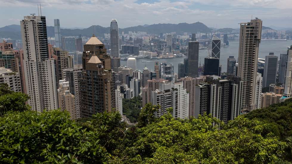 epa10135667 Residential and commercial buildings stand on Hong Kong island and the Kowloon Peninsula as seen from the 6th Generation Peak Tram during an unveiling press preview trip in Hong Kong, China, 24 August 2022. The Peak Tram cars will open to the public on 27 August 2022, after an upgrade project that included the replacement of all haulage, control and signalling systems, ropes and track trails. The new Peak Tram has been manufactured in Switzerland by Garaventa and comprises two cars with a capacity of 210 passengers.  EPA/JEROME FAVRE
