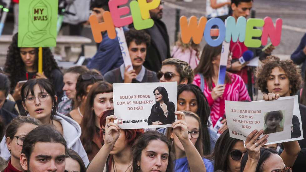 epa10208206 Action of solidarity with women and all oppressed people in Iran, including ethnic minorities and the LGBTI+ population, Lisbon, Portugal, 26 September 2022. Mahsa Amini, a 22 year old girl, was detained on 13 September by the police unit responsible for enforcing Iran's strict dress code for women. Amini was declared dead on 16 September, after she spent three days in a coma.  EPA/MANUEL DE ALMEIDA