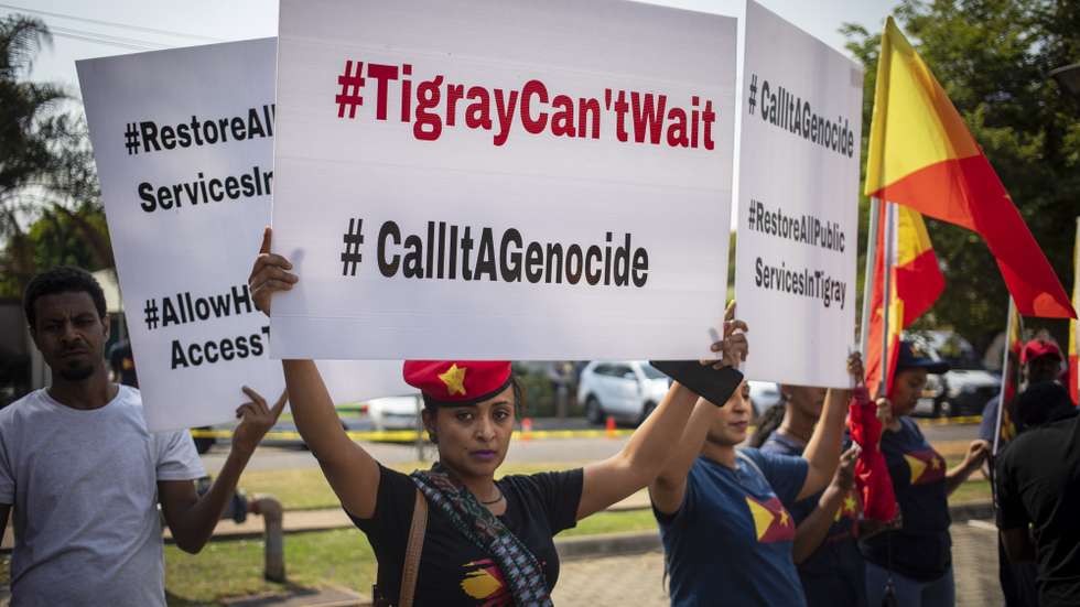 epa10238105 Members of the Tigrayan Community in South Africa (TICASA) gather outside the United States Embassy calling for the end to their claimed genocide of the Tigray communities in Ethiopia; in Pretoria, South Africa, 12 October 2022. The protestors called for the end to the blockade of the region and the continued use of drones to target Tigray communities in their homeland.  EPA/KIM LUDBROOK