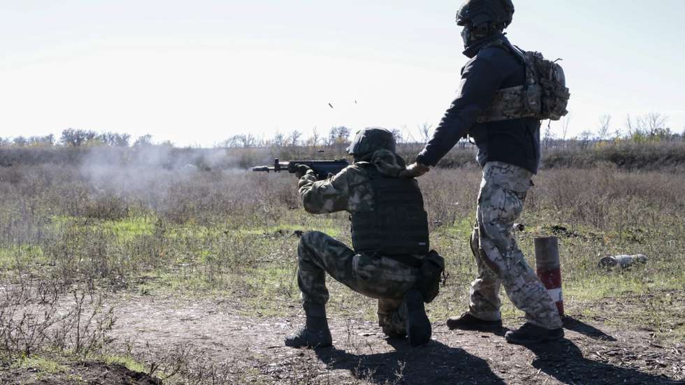 epa10224891 A Russian conscript with an instructor attends a shooting training at a military shooting range near Donetsk, Ukraine, 05 October 2022. Russian President Putin announced in a televised address to the nation on 21 September, that he signed a decree on partial mobilization in the Russian Federation. Russian Defense Minister Shoigu said that 300,000 people would be called up for service as part of the move. On 24 February 2022 Russian troops entered the Ukrainian territory in what the Russian president declared as a 'Special Military Operation', starting an armed conflict that has provoked destruction and a humanitarian crisis.  EPA/ALESSANDRO GUERRA