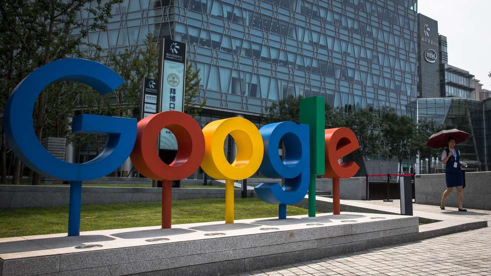 epa08873749 (FILE)  A Chinese woman walks next to a 'Google' brand name and logo, near the Google office in Beijing, China, 03 August 2018 (reissued 10 December 2020). According to media reports on 10 December 2020, French data privacy regulator CNIL will impose over 100 million euros fines on US companies Google and Amazon for breaching EU privacy data rules. According to media reports, Google will have to pay 100 million euros and Amazon 35 million euros fines.  EPA/ROMAN PILIPEY *** Local Caption *** 55208312