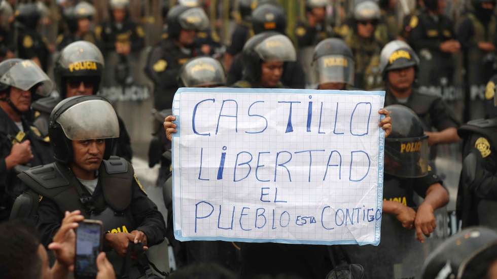 epaselect epa10358548 Members of the police monitor protesters in favor of Pedro Castillo and against Congress demonstrate on the streets of downtown Lima, Peru, 09 December 2022. Demonstrators blocked some roads in the south, to protest against the new president of the Republic, Dina Boluarte, and to demand the advancement of general elections. The protests have been concentrated especially in the southern cities of Ica, Arequipa, Tacna and Cuzco, as well as mobilizations in Chimbote and Chiclayo, north of Lima, and in the Peruvian capital.  EPA/Paolo Aguilar