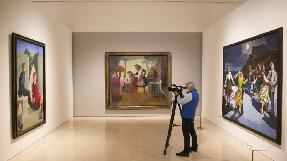 epa09909847 A camera man stands between the artworks 'The Maids' (C), 'The Cadet and his Sister' (L) and 'The Dance' (R) by Portuguese artist Paula Rego during the opening of the exhibition 'Paula Rego' at the Picasso Museum in Malaga, southeastern Spain, 26 April 2022. The exhibition is organized by the Tate Britain in collaboration with the Kunstmuseum Den Haag and the Malaga Picasso Museum, and will be open for the public until 27 August.  EPA/Alvaro Cabrera