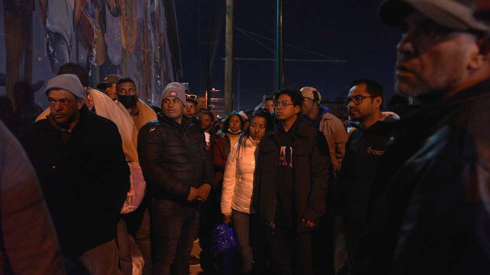 epa10375320 Migrants line up to try to get one of the few beds at Sacred Heart Church in El Paso, Texas, US, 20 December 2022. Migrants are forced to spend the days and nights on the streets of El Paso after being released by US Border Patrol due to shelters being beyond capacity. Supreme Court Chief Justice John Roberts temporarily halted the end of the Title 42 policy that allows the US to expel migrants at the southern border without the chance for asylum.  EPA/ALLISON DINNER