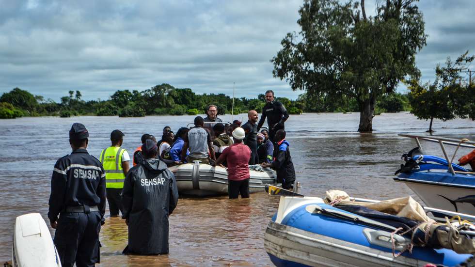 epa10461087 Locals are evacuated from flooded areas in Maputo, Mozambique, 11 February 2023. More than 300 people were rescued boats of the authorities, companies and individuals who have pulled them out of trees, roofs of houses or pieces of land that remained as islands. According to Mozambique's National Institute for Disaster Management (INGD) about 2,400 families have been affected with many of those in a critical situation.  EPA/LUIS FONSECA