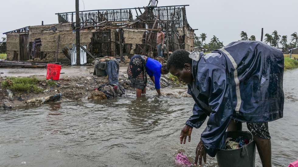 Women wash some clothes in a stream after the destruction caused by the storm Freddy in Quelimane, Mozambique, 13 March 2023. This is one of the longest lasting storms ever, after it formed at the beginning of February in the Asian seas, crossing the entire Indian Ocean to the east African coast. ANDRE CATUEIRA/LUSA