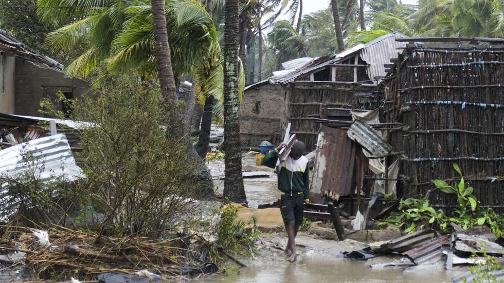 epaselect epa10517496 A man collects some wood on a flooded street near Quelimane, as the storm Freddy hits Mozambique, 12 March 2023. The provincial capital of Quelimane will be the largest urban area closest to the cyclone's point of arrival on the mainland, and its radius (of about 300 kilometres) is expected to extend from Marromeu to Pebane, then moving inland towards Cherimane and southern Malawi. This is one of the longest lasting storms ever, after it formed at the beginning of February in the Asian seas, crossing the entire Indian Ocean to the east African coast.  EPA/ANDRE CATUEIRA