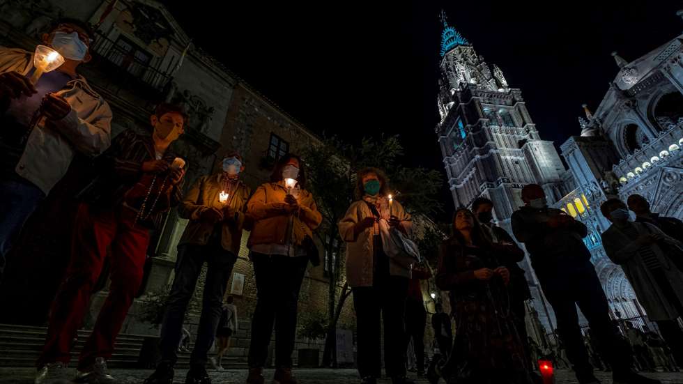 epa09518065 A group of faithful pray the rosary in front of the cathedral in Toledo, Spain, late 10 October 2021 (issued 11 October 2021), as an act of reparation after the release of a music video by Spanish rapper C. Tangana and singer Nathy Peluso that was filmed inside the church. The prayers were called as an act of reparation by Archbishop of Toledo, Francisco Cerro, who apologized on 08 October 2021, for permitting the filming of the music video and allowing 'an unappropriate use of a sacred place.' The music video shows C. Tangana and Nathy Peluso dancing to the theme 'Ateo' (Atheist) in a 'provocative way' according to the Arcbishop, although he stressed the footage 'does not attack faith'. According to the Archbishopric of Toledo, they ignored the content of what was going to be filmed or the final result, and will now study the procedure that allowed the filming at the cathedral to avoid similar events from happening again.  EPA/ANGELES VISDOMINE