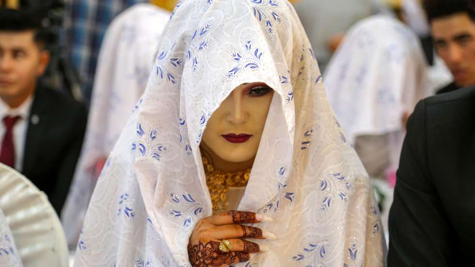 epa10732829 A bride attends a mass wedding organized by Shahada Charity Foundation to help support the families who cannot afford wedding expenses, in Kabul, Afghanistan, 07 July 2023. The Taliban have imposed a strict ban on music during wedding celebrations as part of their crackdown on activities deemed contrary to Islamic teachings. The Ministry for the Propagation of Virtue and the Prevention of Vice has instructed hall owners to cease playing music at wedding parties. In 2022, the Taliban's ban on music was not heavily enforced, but the restrictions have increased since their return to power. Music is believed to go against the teachings of Islam by the Taliban, who had previously outlawed various activities during their rule from 1996-2001. Consequently, many artists and musicians have fled Afghanistan. Afghan women and girls are facing the most restrictions, including bans on attending schools and universities and holding certain jobs.  EPA/SAMIULLAH POPAL