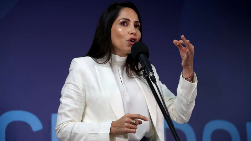epa10799269 Presidential candidate Luisa Gonzalez speaks after arriving at the headquarters of the Ecuador television station where the 2023 presidential debate will take place, in Quito, Ecuador, 13 August 2023. The candidates for the presidency of Ecuador will present their government plans during a debate organized by the National Electoral Council (CNE). The event will be marked by the death of Fernando Villavicencio, the candidate assassinated on 09 August 2023.  EPA/Jose Jacome