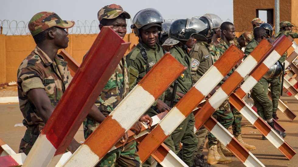 epa10820357 Police stand guard at the roundabout leading to the French base during a protest against the French military presence in Niger in Niamey, Niger, 25 August 2023. The junta has given 48 hours to the French ambassador to leave the country. A month has passed since general Abdourahamane Tchiani proclaimed himself the leader of a new military junta after ousting democratically elected President Mohamed Bazoum.  EPA/ISSIFOU DJIBO