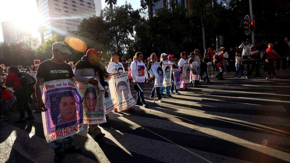 epaselect epa10885133 Fathers and mothers of the 43 young people who disappeared from Ayotzinapa in September 2014, and students from the rural school located in the southern state of Guerrero, hold a demonstration to commemorate the ninth anniversary of the 43 missing Mexicans from Ayotzinapa, in Mexico City, Mexico, 26 Septemeber 2023. Thousands of people marched on the ninth anniversary of the disappearance of the 43 students of Ayotzinapa after years of small advances.  EPA/Sashenka Gutierrez