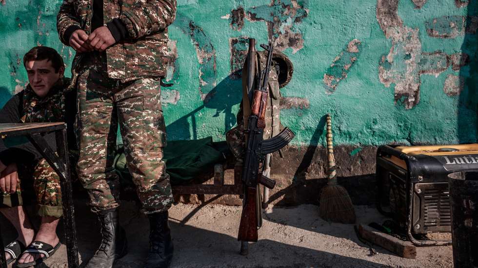 epa10893783 (FILE) - Armenian soldiers wait at a military control point in Martakert, a north-eastern city of the self-proclaimed Nagorno-Karabakh Republic, 17 January 2021. (Issued 01 October 2023). The self-declared Republic of Nagorno-Karabakh, is a territory mostly home to ethnic Armenians that the Soviets allocated to Azerbaijan in 1921 and is recognized as Azerbaijani by the international community.  Some 120,000 ethnic Armenians of the enclave have, in September 2023, joined again the roads to exodus. Caught in the conflict  with Azerbaijan,  and after dozens of violence flares since the 1990's, they have repeatedly had to leave their lands and become displaced or refugees in the tens of thousands, losing over the years their homes and thousands of loved ones to direct fighting or to collateral damage.  After a ceasefire was agreed on, on 20 September 2023, Azerbaijan opened all the checkpoints with Armenia for the unimpeded exit of civilians from the disputed territory. The Armenian government announced the evacuation of more than 96,000 local residents from Nagorno-Karabakh, and a humanitarian center has been set up near the main route between Armenia and the breakaway region. Nagorno-Karabakh will cease to exist as a self-proclaimed state from 01 January 2024, the region's separatist leader, Samvel Shakhramanyan, announced on 28 September, after signing a decree to dissolve all its institutions.  EPA/CHRISTOPHE PETIT TESSON ATTENTION: For the full PHOTO ESSAY text please see Advisory Notice epa09033329 and epa09033330 ATTENTION: This Image is part of a PHOTO SET *** Local Caption *** 56719908