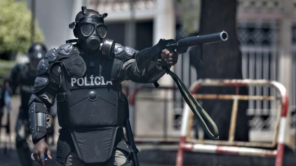 epaselect epa10942456 A riot police member fires tear gas canister during a protest march by supporters of the Mozambican National Resistance (RENAMO) in repudiation of the results of the sixth municipal elections in Maputo, Mozambique, 27 October 2023. The National Elections Commission (CNE) of Mozambique declared the triumph of the ruling party, Frelimo, in 64 out of the country's 65 municipalities on 26 October.  EPA/LUISA NHANTUMBO