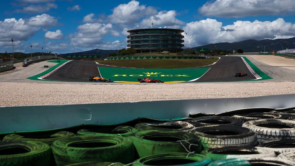 epa09172219 Spanish Formula One driver Carlos Sainz (C) of Scuderia Ferrari in action during the qualifying session of the Formula One Grand Prix of Portugal at Autodromo Internacional do Algarve, near Portimao, Portugal, 01 May 2021. The Formula One Grand Prix of Portugal will take place on 02 May 2021.  EPA/JOSE SENA GOULAO