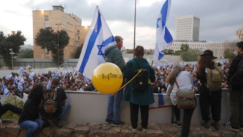 epa10982564 Family members, friends and supporters of the hostages held by Hamas in Gaza take part in a march from Tel Aviv to Jerusalem, outside the Prime Minister's office in Jerusalem, 18 November 2023. Hundreds of families, friends and supporters on 14 November, began a five-day march to the Israeli Knesset (parliament) in Jerusalem, calling on the government to bring their loved ones home. Hamas has taken at least 240 people hostage in Gaza, including women, children and the elderly, following the militant group's 07 October attack from the Gaza Strip into Israel, the IDF said.  EPA/ABIR SULTAN