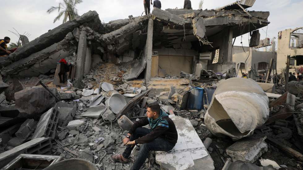 epa11017987 Palestinians inspect a destroyed house of the Baraka family following Israeli airstrikes, in Deir Al Balah, central Gaza Strip, 08 December 2023. Israeli forces resumed military strikes on Gaza after a week-long truce expired on 01 December. More than 15,000 Palestinians and at least 1,200 Israelis have been killed, according to the Gaza Government media office and the Israel Defense Forces (IDF), since Hamas militants launched an attack against Israel from the Gaza Strip on 07 October, and the Israeli operations in Gaza and the West Bank which followed it. The United Nations Relief and Works Agency for Palestine Refugees in the Near East (UNRWA) stated that most civilians in the Gaza Strip are in 'desperate need of humanitarian assistance and protection'.  Approximately 1.8 million inhabitants, which amounts to nearly 80 percent of the population, are displaced within Gaza, and all of Gaza's 2.3 million residents 'lack sufficient food and clean water, and face malnutrition'.  EPA/MOHAMMED SABER